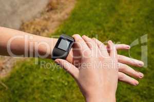 Woman using smartwatch in the gym