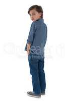 Boy posing against white background