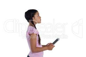 Girl holding digital tablet against white background