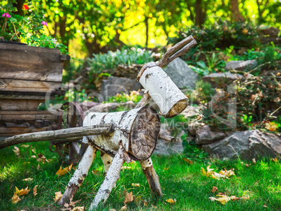 a figure of wood logs in the garden