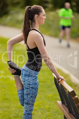 Woman performing stretching exercise in the park