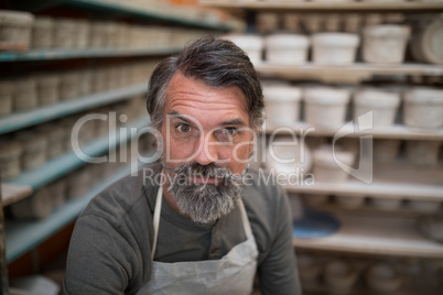 Male potter in pottery workshop