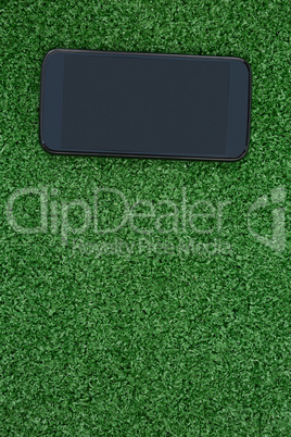 Mobile phone on artificial grass