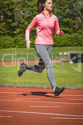 Woman jogging on a race track