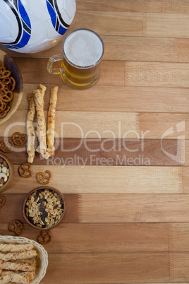 Fresh snacks and beer on wooden table