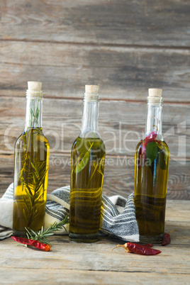 Olive oil bottles with herbal and spices