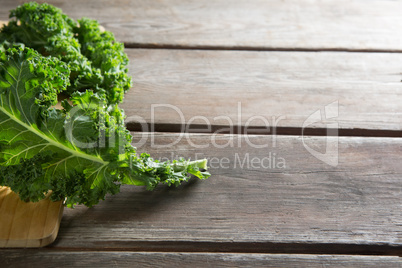 Close up of fresh kale leaves on table