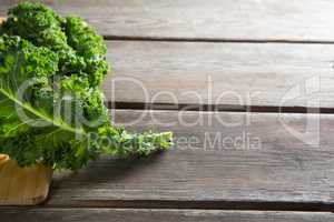 Close up of fresh kale leaves on table