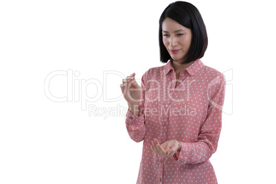 Woman pretending to hold an invisible object