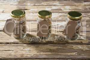 Three jar with various breakfast cereals