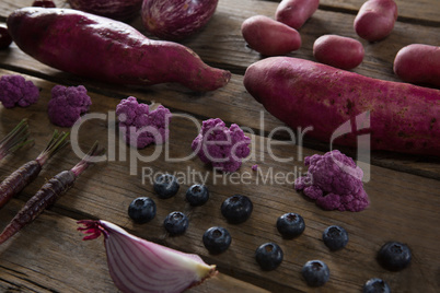 Various vegetable arranged on wooden table