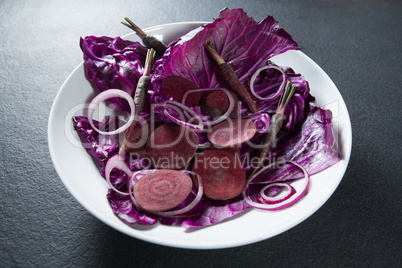 Vegetables in plate on slate