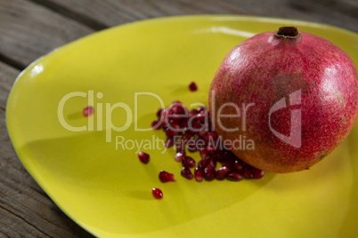 Pomegranate in a table on a wooden table