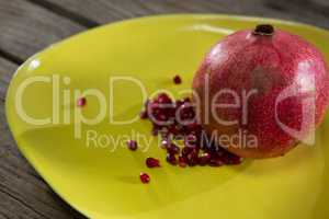 Pomegranate in a table on a wooden table