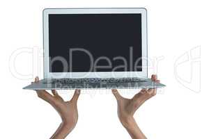 Female executive holding laptop