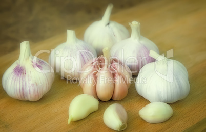 Garlic on a cutting Board on the table.