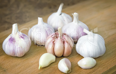 Garlic on a cutting Board on the table.