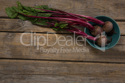 Beetroots in a bowl on wooden table