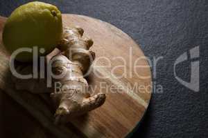 Ginger and lemon on chopping board