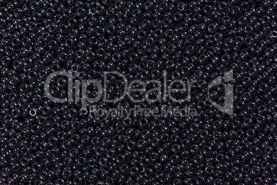 Abstract texture dark purple glass beads.