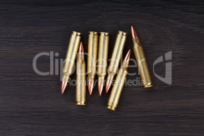 Old ammunition on the wood background. Army equipment.