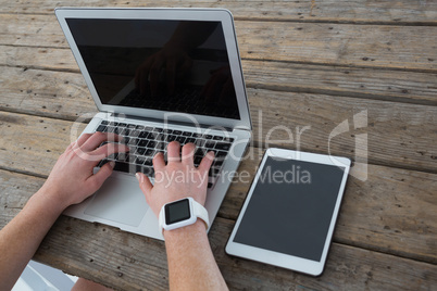 High angle view of businesswoman using laptop computer