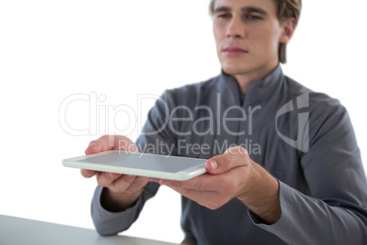 Businessman holding digital tablet