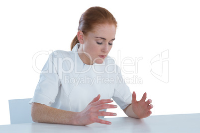 Young businesswoman looking at imaginary product