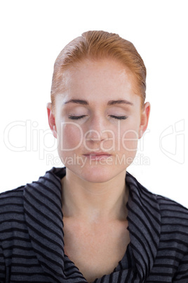 Close up of young businesswoman with eyes closed