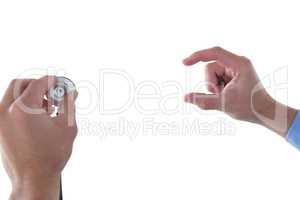 Cropped hand on doctor holding stethoscope while using invisible interface