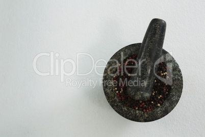 Black pepper in mortar and pestle