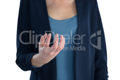 Mid section of businesswoman holding imaginary product