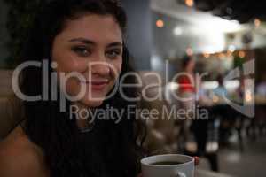 Portrait of beautiful woman having coffee