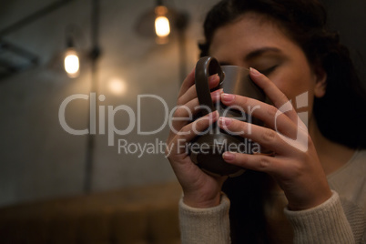 Beautiful woman having coffee