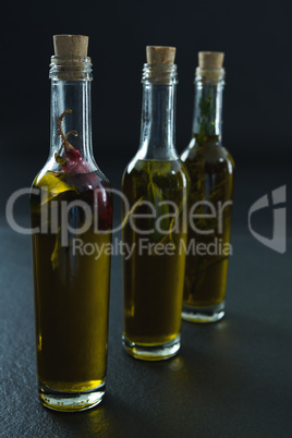 Bottles of olive oil with herbs