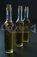 Bottles of olive oil with herbs