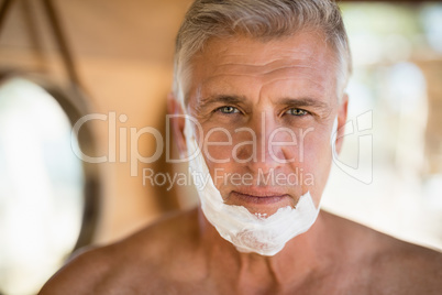 Portrait of man with shaving cream on his face