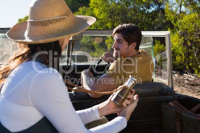 Man with woman in off road vehicle