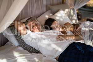 Senior couple sleeping on canopy bed