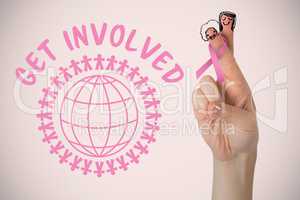 Composite image of cropped hand with breast cancer awareness ribbon