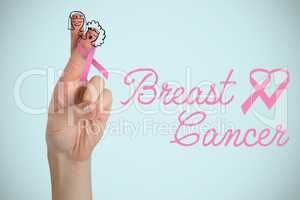 Composite image of breast cancer awareness ribbon on cropped hand of woman