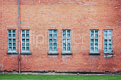 Abandoned architecture background with brick wall and windows