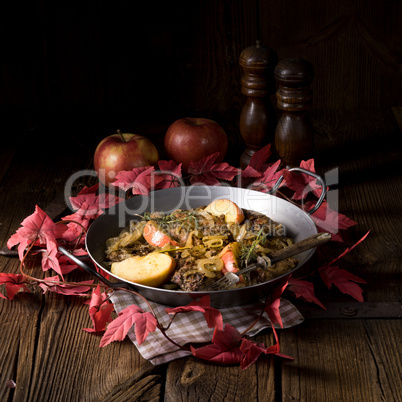 Fried liver with onion apple and herbs.