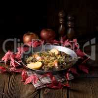 Fried liver with onion apple and herbs.