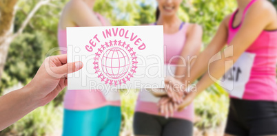 Composite image of hand holding card