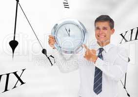 Business man holding a clock against background with clocks