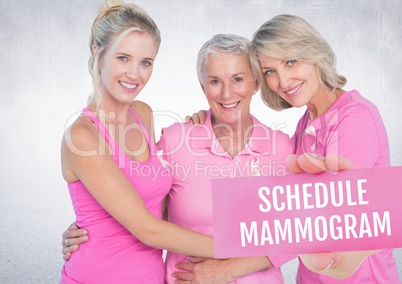 Schedule mammogram Text and Hand holding card with pink breast cancer awareness women