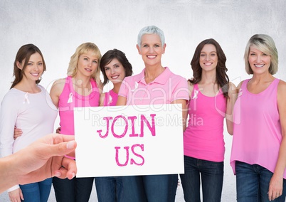 Join Us Text and Hand holding card with pink breast cancer awareness women