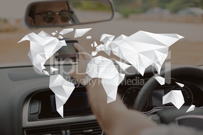 World map illustration against man in the car