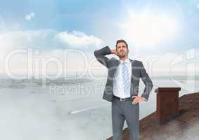 Businessman standing on Roof with chimney and city sea port